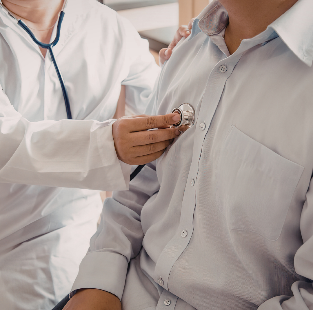 provider listening to patient heart with stethoscope